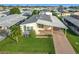 Aerial view of a single-wide manufactured home with carport and well-maintained lawn at 6461 Hollyberry Ne Ln, Winter Haven, FL 33881