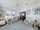 Bright sunroom with sliding glass doors leading to the backyard and floral sofa at 6461 Hollyberry Ne Ln, Winter Haven, FL 33881