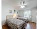Guest bedroom with two twin beds and floral bedding at 6461 Hollyberry Ne Ln, Winter Haven, FL 33881
