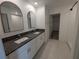 Modern bathroom with double vanity, granite countertop and walk-in shower at 2739 Red Egret Dr, Bartow, FL 33830