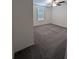 Well-lit bedroom with grey carpet and ceiling fan at 2739 Red Egret Dr, Bartow, FL 33830