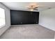 Spacious bedroom with gray carpet and a dark accent wall at 2739 Red Egret Dr, Bartow, FL 33830