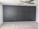 Spacious bedroom with gray carpet and a dark accent wall at 2739 Red Egret Dr, Bartow, FL 33830