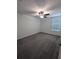 Bright bedroom featuring grey carpet and a ceiling fan at 2739 Red Egret Dr, Bartow, FL 33830