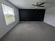 Spacious bedroom with gray carpet and a dark accent wall at 2739 Red Egret Dr, Bartow, FL 33830