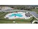Community pool with lounge chairs and a shaded seating area at 2739 Red Egret Dr, Bartow, FL 33830