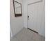 Clean entryway with tile floors, mirror, and key holder at 2739 Red Egret Dr, Bartow, FL 33830
