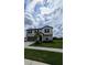 Two-story house with a neutral color scheme, landscaping, and a two-car garage at 2739 Red Egret Dr, Bartow, FL 33830