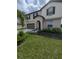 Two-story house with a neutral color scheme, landscaping, and a two-car garage at 2739 Red Egret Dr, Bartow, FL 33830