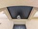 Modern front door with a black finish and a stylish light fixture at 2739 Red Egret Dr, Bartow, FL 33830