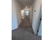 Upstairs hallway with carpet leading to bedrooms and bathroom at 2739 Red Egret Dr, Bartow, FL 33830