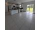 Open concept kitchen with island and view to backyard at 2739 Red Egret Dr, Bartow, FL 33830