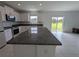 Modern kitchen with granite countertops and access to backyard at 2739 Red Egret Dr, Bartow, FL 33830
