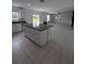 Modern kitchen with granite island and stainless steel appliances at 2739 Red Egret Dr, Bartow, FL 33830