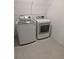 Laundry room with LG washer and dryer, and overhead shelving at 2739 Red Egret Dr, Bartow, FL 33830
