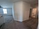 Upstairs hallway with carpet and access to bathroom and bedrooms at 2739 Red Egret Dr, Bartow, FL 33830