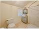 Updated bathroom with gray vanity, shower, and toilet at 285 Lemon St, Mulberry, FL 33860