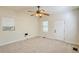 Spacious bedroom with ceiling fan, window, and exterior access at 285 Lemon St, Mulberry, FL 33860