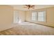 Well-lit bedroom with ceiling fan and window coverings at 285 Lemon St, Mulberry, FL 33860