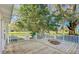Wooden deck with white railings overlooks grassy yard at 285 Lemon St, Mulberry, FL 33860