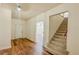 Entryway with wood floors and staircase leading upstairs at 285 Lemon St, Mulberry, FL 33860