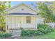 Charming white house with a front porch at 285 Lemon St, Mulberry, FL 33860
