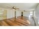 Spacious living area featuring hardwood floors and two ceiling fans at 285 Lemon St, Mulberry, FL 33860