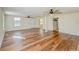 Bright living room with hardwood floors, ceiling fans, and ample natural light at 285 Lemon St, Mulberry, FL 33860