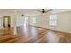 Large living room with hardwood floors and ceiling fans at 285 Lemon St, Mulberry, FL 33860