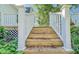Wooden stairs lead down from deck at 285 Lemon St, Mulberry, FL 33860