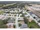 Aerial view of a residential neighborhood with houses and landscaping at 4197 Cannes Ave, Lake Wales, FL 33859
