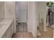 Full bathroom with walk-in closet and laundry area at 4197 Cannes Ave, Lake Wales, FL 33859
