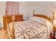 Bedroom with wooden bed frame and dresser at 4197 Cannes Ave, Lake Wales, FL 33859