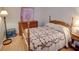 Bedroom with wooden bed frame and dresser at 4197 Cannes Ave, Lake Wales, FL 33859