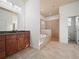 Elegant bathroom with soaking tub, walk-in shower, and double vanity at 4511 Micanope Crescent Dr, Lakeland, FL 33811