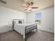 Bright bedroom with a metal bed frame and window view at 4511 Micanope Crescent Dr, Lakeland, FL 33811