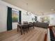 Bright dining area with a table for six and views into the living room at 4511 Micanope Crescent Dr, Lakeland, FL 33811
