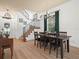 Formal dining room features a wood table, chandelier, and staircase at 4511 Micanope Crescent Dr, Lakeland, FL 33811