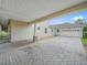 Covered paver driveway and attached garage at 4511 Micanope Crescent Dr, Lakeland, FL 33811