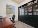 Home office with built-in bookcases and a large window at 4511 Micanope Crescent Dr, Lakeland, FL 33811