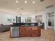 Island kitchen with granite countertops, stainless steel appliances, and breakfast bar at 4511 Micanope Crescent Dr, Lakeland, FL 33811