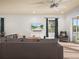 Relaxing living room with sectional sofa, large TV, and natural light at 4511 Micanope Crescent Dr, Lakeland, FL 33811