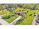 Aerial view of a house with a large grassy yard and driveway at 4616 Musket Dr, Lakeland, FL 33810