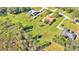 Aerial view of property showcasing house, pool, shed, and surrounding land at 4616 Musket Dr, Lakeland, FL 33810