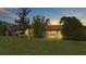 House exterior view at dusk with a large backyard at 4616 Musket Dr, Lakeland, FL 33810