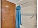 Clean bathroom with shower/tub combo and blue shower curtain at 4616 Musket Dr, Lakeland, FL 33810