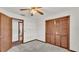 Simple bedroom with ceiling fan, carpet, and built-in closet at 4616 Musket Dr, Lakeland, FL 33810