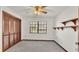 Simple bedroom with wood louvered doors and wall shelving at 4616 Musket Dr, Lakeland, FL 33810