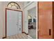 Entryway with tiled floor and view into the living room at 4616 Musket Dr, Lakeland, FL 33810