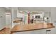 Kitchen features light cabinetry, wood countertops, and views into the dining area at 4616 Musket Dr, Lakeland, FL 33810